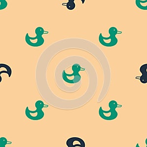 Green and black Rubber duck icon isolated seamless pattern on beige background. Vector