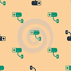 Green and black Security camera icon isolated seamless pattern on beige background. Vector