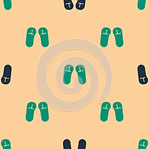 Green and black Slipper icon isolated seamless pattern on beige background. Flip flops sign. Vector Illustration