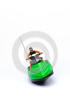 Green and Black Speed Boat Toy Isolated in White Background