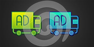 Green and blue Advertising on truck icon isolated on black background. Concept of marketing and promotion process