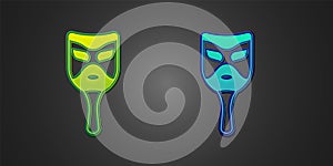 Green and blue Carnival mask icon isolated on black background. Masquerade party mask. Vector