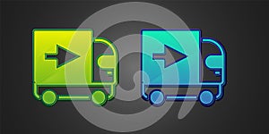 Green and blue Delivery cargo truck vehicle icon isolated on black background. Vector