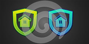 Green and blue House with shield icon isolated on black background. Insurance concept. Security, safety, protection