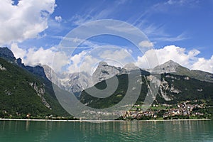 Green and blue landscape of Molveno lake with some clouds