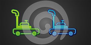 Green and blue Lawn mower icon isolated on black background. Lawn mower cutting grass. Vector