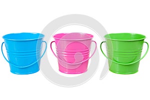 Green, blue and pink pails, buckets