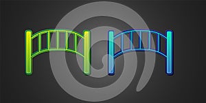 Green and blue Playground kids bridge icon isolated on black background. Vector