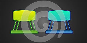 Green and blue Pommel horse icon isolated on black background. Sports equipment for jumping and gymnastics. Vector