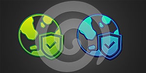 Green and blue Shield with world globe icon isolated on black background. Insurance concept. Security, safety