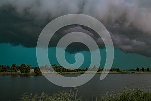 Green blue sky below the base of a thunderstorm