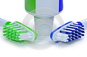 Green, blue toothbrushes and toothpaste isolated on a white back