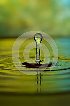 Green and blue water drop and splash