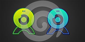 Green and blue Web camera icon isolated on black background. Chat camera. Webcam icon. Vector