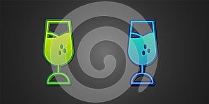 Green and blue Wine glass icon isolated on black background. Wineglass sign. Vector
