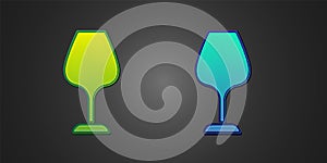 Green and blue Wine glass icon isolated on black background. Wineglass sign. Vector