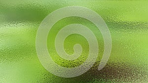 Green blurred abstract background. Frosted fluted glass