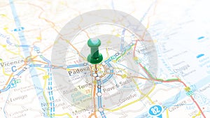 A green board pin stuck in Padova on a map of Italy photo