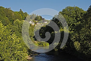 Green borders of river Ourthe near La-Roche-en-Ardenne photo