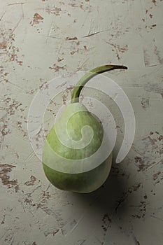 Green bottle gourd on white background