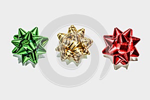 Green bow, gold bow, red bow. Christmas decorations. Objects isolated on white