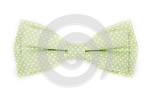 Green bow tie with white polka dots