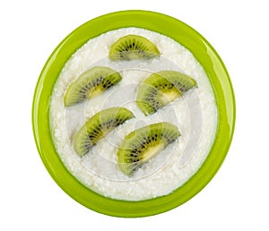 Bowl with cottage cheese and kiwi fruits isolated on white background. Top view