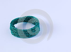 Green bracelet, on white background.