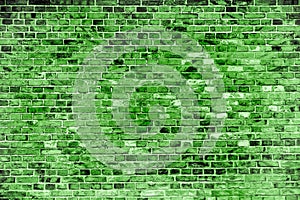 Green brick wall painted with different tones and hues of green as seamless pattern texture background