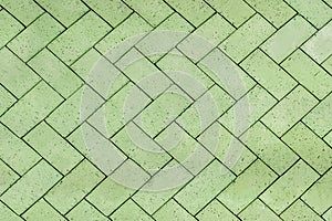 Green bricks tiled floor with zigzag pattern texture background