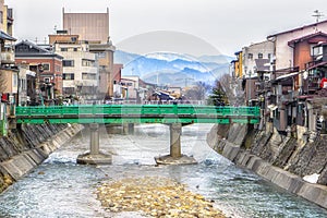 Green bridge over the river in Takayama,Japan