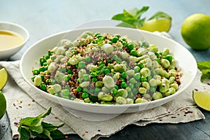 Green Broad beans and quinoa salad with sweet peas and mint. Healthy vegan food