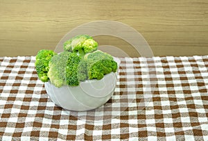 Green broccoli in white bowl