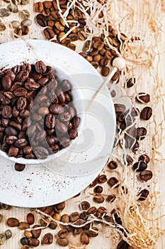 Green, brown and black coffee beans