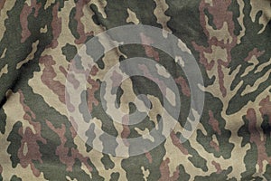 Green and brown military camouflage uniform pattern.