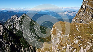 Green and brown mountain peaks on Mangart saddle in Slovenia in Autumn