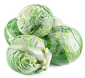 Green brussel sprouts with water drops on white background. Clipping path