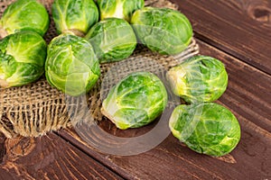 Green brussels sprout on brown wood