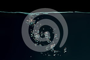 Green bubbles floating in a black background.