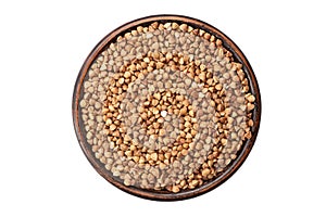 Green buckwheat grain in clay bowl isolated on white background, top view. File contains clipping path