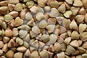 green buckwheat texture background. Natural healty food, close-up top view