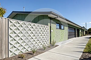 Green Building with Geometric Patterned Concrete Fins photo