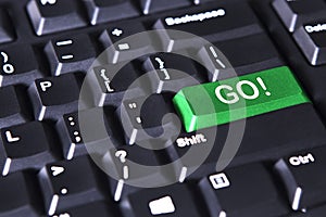 Green button with GO word and exclamation point