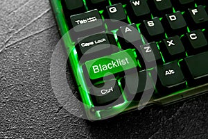 Green button with word Blacklist on computer keyboard, closeup