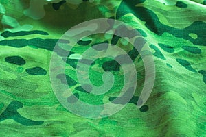 Green camouflage fabric texture for background. For hunting or fishing and military clothes