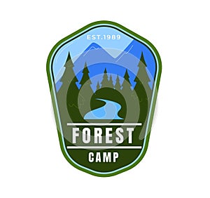 Green camping badge with mountain, pine trees, and river. Outdoor adventure logo, forest camp emblem design. Nature