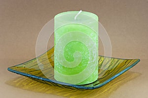 Green candle on the tray