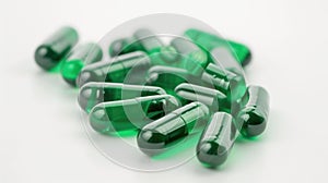 Green Capsule Pills on White Surface