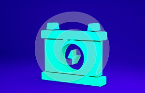 Green Car battery icon isolated on blue background. Accumulator battery energy power and electricity accumulator battery