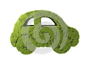Green car with grass growing on it